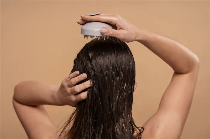 medium-shot-woman-giving-herself-scalp-massage.jpg